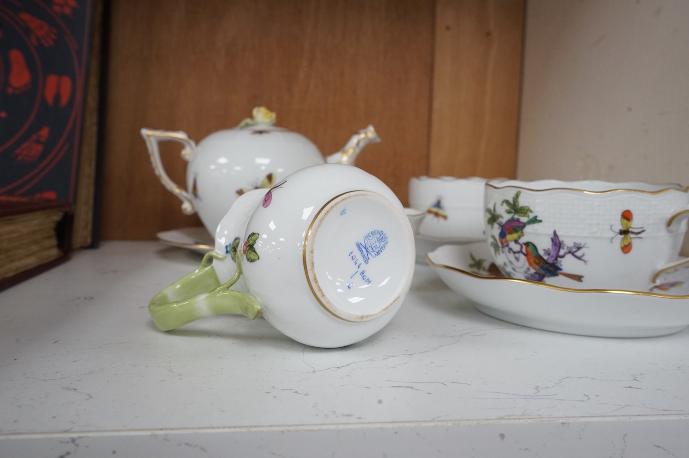 A Herend porcelain Rothschild Birds pattern tête-à-tête tea service, decorated with birds and butterflies. (8 piece's) teapot 10cm high